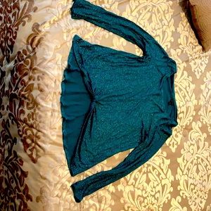 party teal blouse that is shiny and has sparkles.